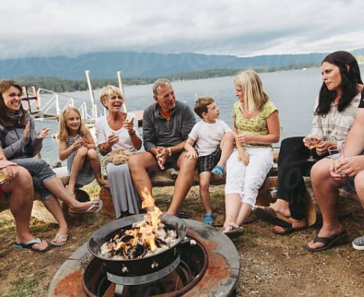 family gathered around a campfire