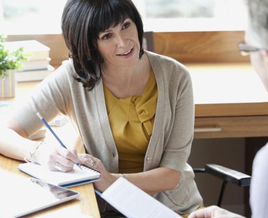 Woman and man sitting at test talking